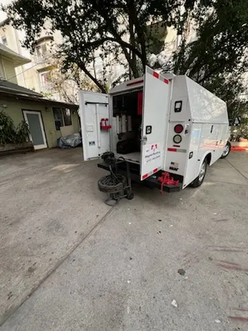 Magnet Plumbing service vehicle on-site for Grease Trap Cleaning in Tarzana